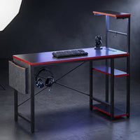 Gaming Desk with Power Outlets, 44 Inch Led Gamer Desk with 4 Tiers Reversible Shelves, PC Gaming Table with Headset Hook & Side Storage Bag for Bedroom (Black 3D Carbon Fiber) — Studio Shot