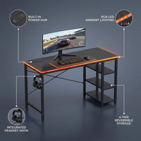 Gaming Desk with Power Outlets, 44 Inch Led Gamer Desk with 4 Tiers Reversible Shelves, PC Gaming Table with Headset Hook & Side Storage Bag for Bedroom (Black 3D Carbon Fiber) — infographic